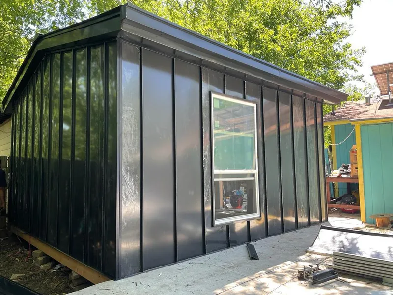 Black standing seam metal wall panels for Roof Inspection in Raisinville