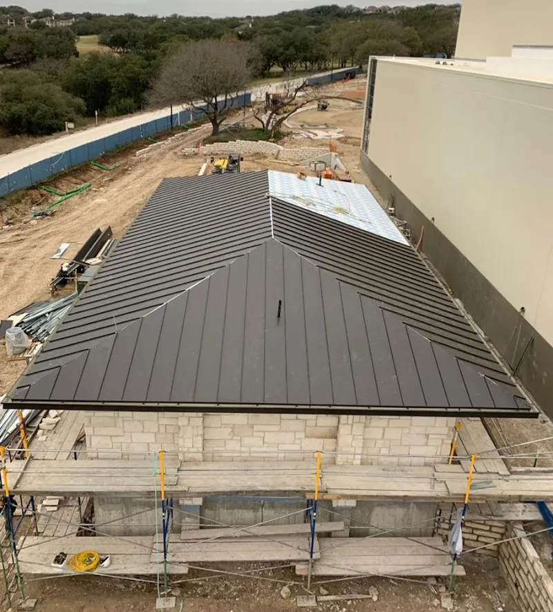 Metal roof new construction with scaffolding in Raisinville
